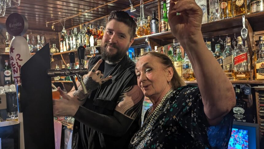 Asmat Tkabladze and David Sullivan are happy behind the bar and pose at Chaba's Jazz Rock Cafe